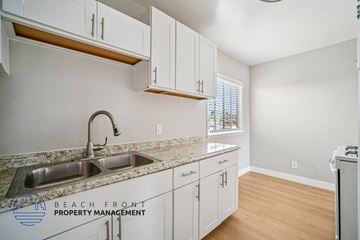 Hawthorne apartment for rent - A kitchen with a sink and cabinets.