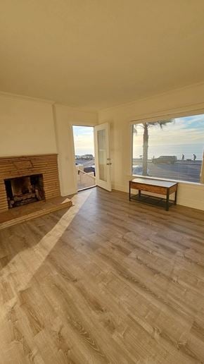 Redondo Beach apartment for rent - A room with a fireplace and a bench with a view of the street outside.