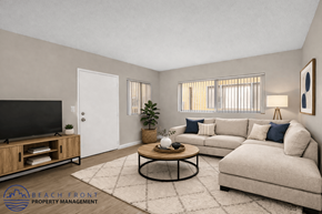 Long Beach apartment for rent - A living room with a television, a sofa, a coffee table, and a rug.