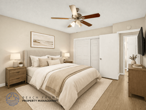 Long Beach apartment for rent - A bedroom with a large bed, a ceiling fan, and a painting on the wall.