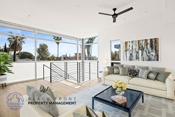West Hollywood apartment for rent - an open living room with a couch and a coffee table