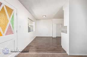 South Gate apartment for rent - A hallway with a carpeted floor and white walls.