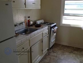 Lennox apartment for rent - a kitchen with a sink a stove and a refrigerator