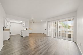 Long Beach apartment for rent - a row of white benches on a wooden floor with white triangles