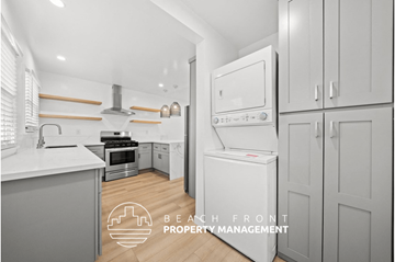 Santa Monica apartment for rent - a white and gray kitchen with white appliances and white cabinets