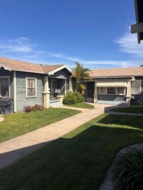 Anaheim apartment for rent - A house with a blue front yard and a white fence.