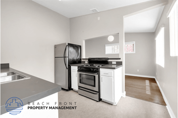 Costa Mesa apartment for rent - a kitchen with stainless steel appliances and a stove and refrigerator