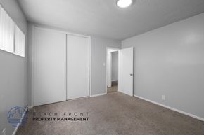 Inglewood apartment for rent - a master bedroom with white closets and a carpeted floor