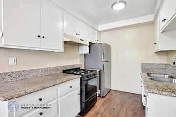 Redondo Beach apartment for rent - A kitchen with white cabinets and a granite countertop.