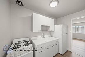 Hawthorne apartment for rent - A white kitchen with a stove, sink, and refrigerator.