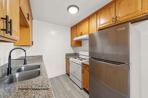 Gardena apartment for rent - A kitchen with a sink, stove, and refrigerator.