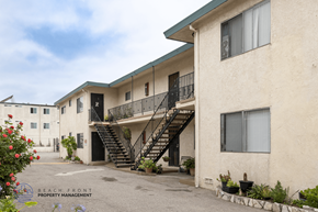Hawthorne apartment for rent - A building with a balcony and stairs leading to the second floor.