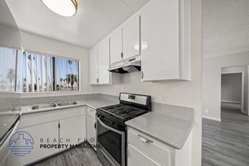 Los Angeles apartment for rent - A kitchen with a stove top oven and a sink.