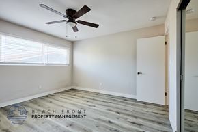 Redondo Beach apartment for rent - A room with a ceiling fan and wooden flooring.