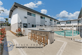 Newport Beach apartment for rent - a patio with a bar and a pool in front of a building