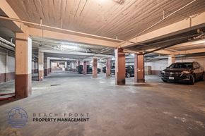Los Angeles apartment for rent - a parking garage with cars parked in it