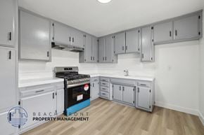 La Habra apartment for rent - A kitchen with a stove top oven and a sink.