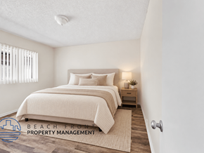 Gardena apartment for rent - A bedroom with a bed, nightstand, and window with blinds.