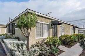 Downey apartment for rent - A house with a garden in front.