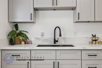 Buena Park apartment for rent - A kitchen with a sink and a plant on the counter.