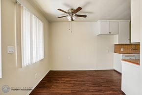 Gardena apartment for rent - A room with a ceiling fan and wooden flooring.