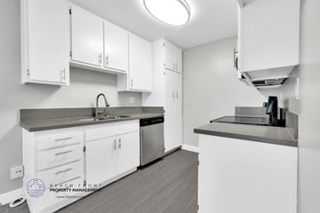 Inglewood apartment for rent - a kitchen with white cabinets and stainless steel appliances