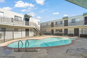 Torrance apartment for rent - A pool with a logo that says Beach Front Property Management.