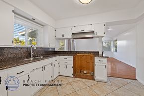 Lomita apartment for rent - A kitchen with a counter top and cabinets.