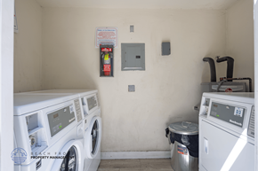 Long Beach apartment for rent - A small laundry room with a washer and dryer.