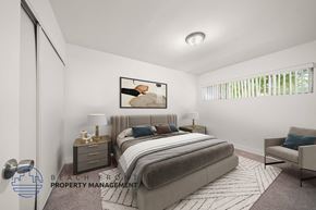Tustin apartment for rent - a bedroom with a bed and a large window