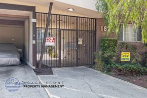 Gardena apartment for rent - A gated entrance to a property with a "For Rent" sign.