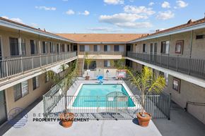 Hawthorne apartment for rent - A pool in a courtyard surrounded by buildings.