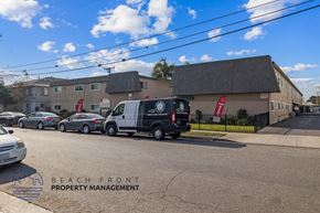 Downey apartment for rent - A street view with cars and a building with the text "BEACH FRONT PROPERTY MANAGEMENT".