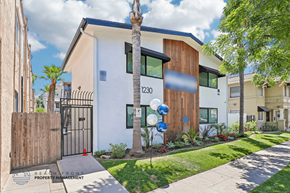 Long Beach apartment for rent - A modern house with a white and brown exterior and a black gate.