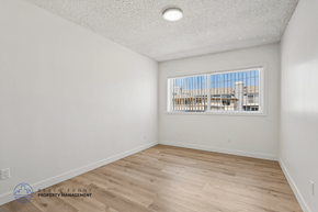 Gardena apartment for rent - A room with a window overlooking a building.