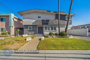 Torrance apartment for rent - a home with a sidewalk and grass in front of it