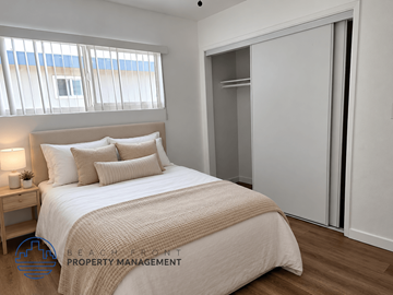 Lomita apartment for rent - A bedroom with a large bed and a sliding door.