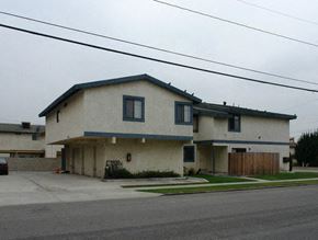 Midway townhouse for rent - a white house sitting on the side of a street