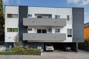Los Angeles apartment for rent - an apartment building with cars parked in front of it