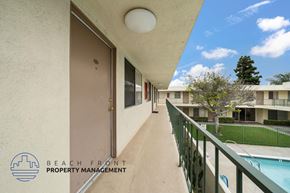 Hawthorne apartment for rent - A balcony with a pool and a building in the background.