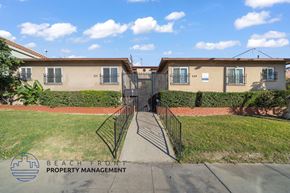 Monterey Park apartment for rent - A building with the words Beach Front Property Management on the bottom left.
