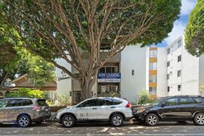 Santa Monica apartment for rent - A silver car with the word "CONTENT" written on it is parked in front of a building with a "NO LEASING" sign.