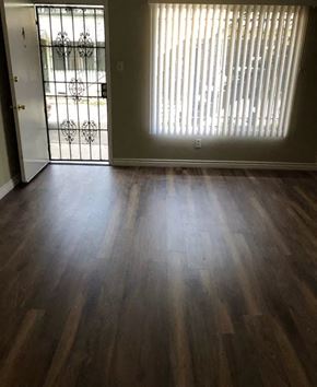 Inglewood apartment for rent - a living room with a wood floor and a glass door