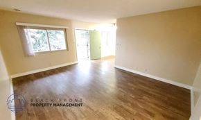 Los Angeles apartment for rent - the living room and dining room of an empty house with wood floors