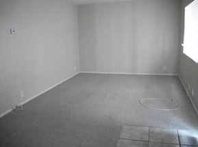 Long Beach apartment for rent - an empty room with a carpeted floor and a window