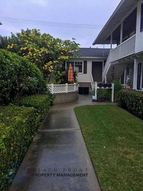 Laguna Beach apartment for rent - a walkway in front of a house with a porch