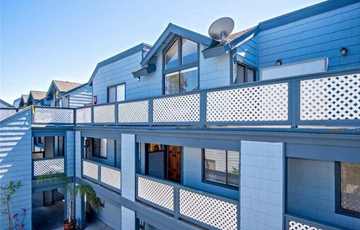Santa Ana apartment for rent - a blue building with a satellite dish on top of it