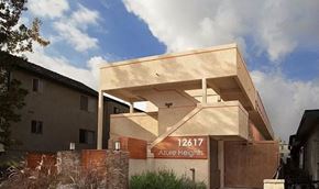 Hawthorne apartment for rent - A modern building with the number 12617 Azure Heights on its signboard.
