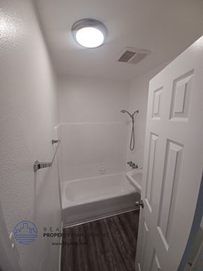 Long Beach apartment for rent - a small bathroom with a shower and a bath tub