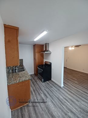 Long Beach apartment for rent - a kitchen and living room of an empty apartment
